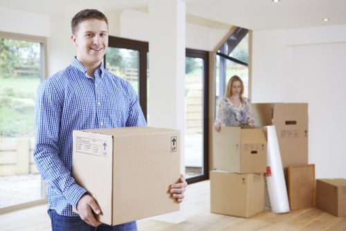 Mover handling boxes and furniture near Bermondsey apartments