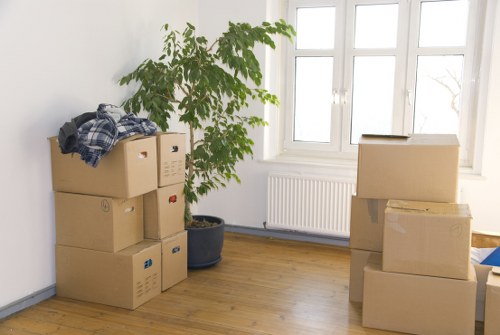 Moving boxes and furniture in a Bermondsey apartment