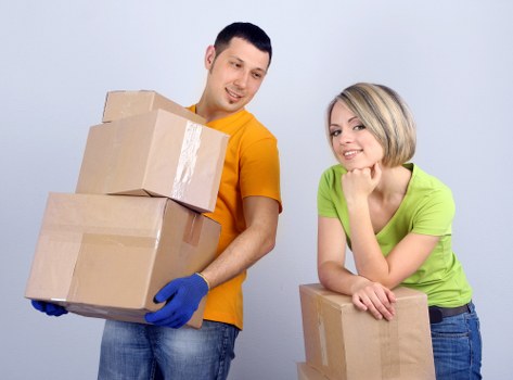 Local removal team carrying boxes from a Bermondsey flat