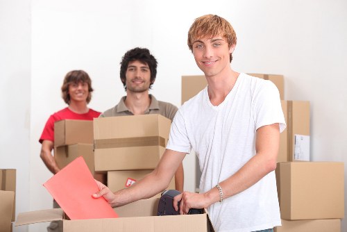 Careful wrapping of fragile household items during a local packing service