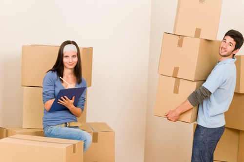 Unpacking boxes and arranging belongings in a new Bermondsey property
